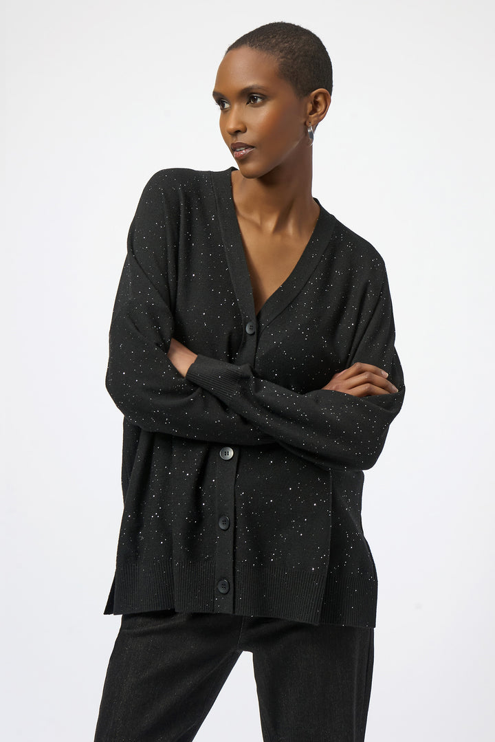 Joseph Ribkoff Fall 2025 
This elegant lightweight sweater features a flattering V-neck and delicate front buttons, adorned with an all-over glitter sparkle for subtle festive shine.