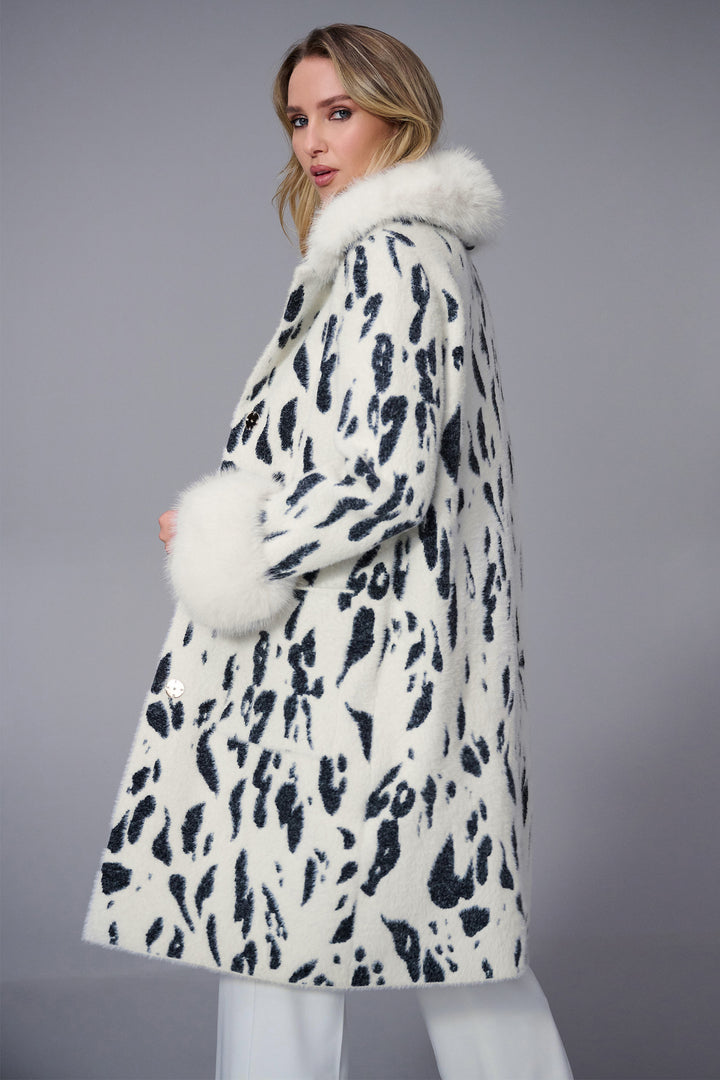 Joseph Ribkoff Fall 2025 
 Made with soft feather yarn and a warm faux fur back collar, this sweater knit coat also features convenient side pockets. 