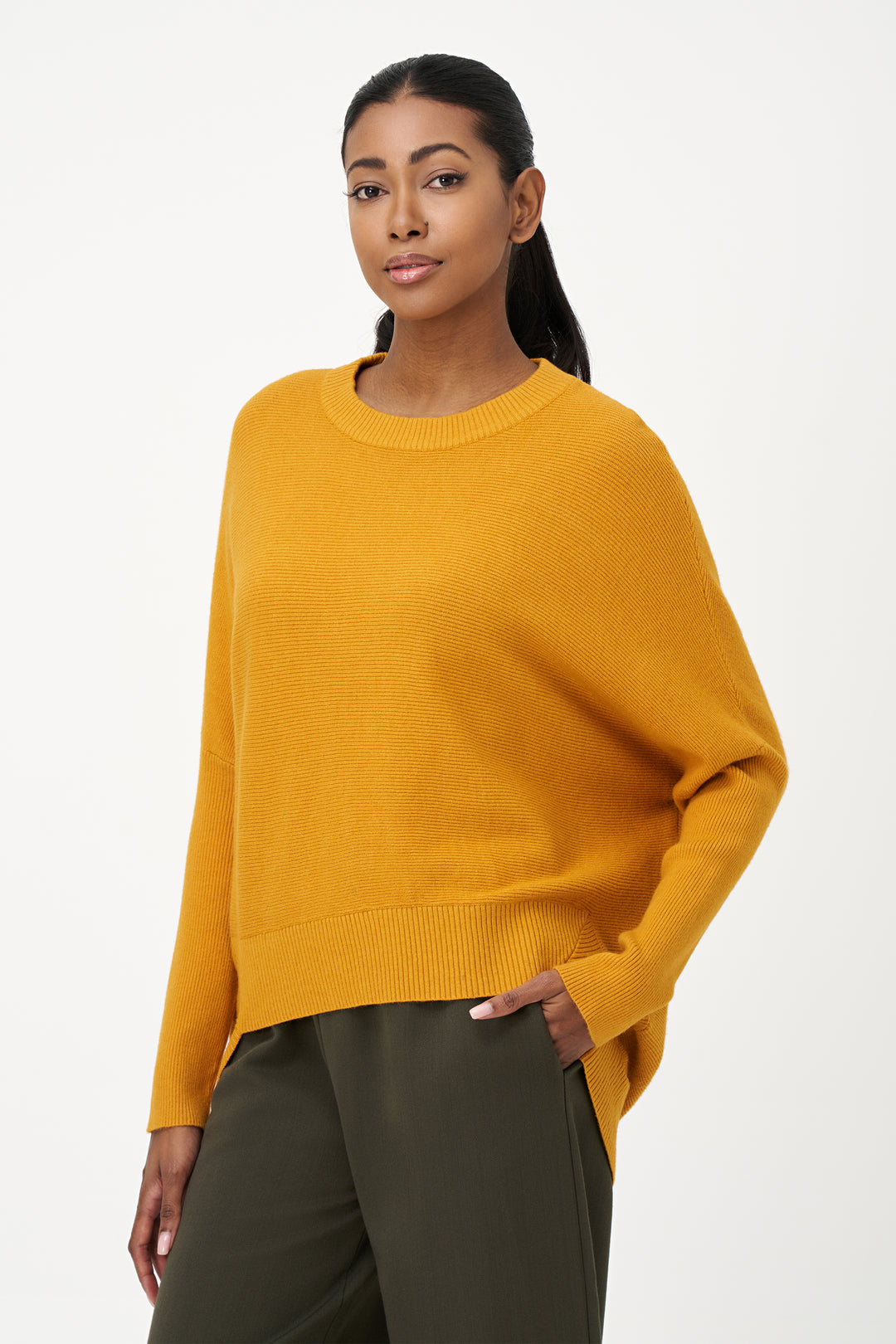 M Italy Fall 2025 
This Hi Lo Dolman Sweater Top features a ribbed contrast crew neck and hemline, adding subtle detail to its relaxed silhouette. Designed with dolman sleeves and a dropped shoulder style, it offers effortless comfort and ease of movement. 