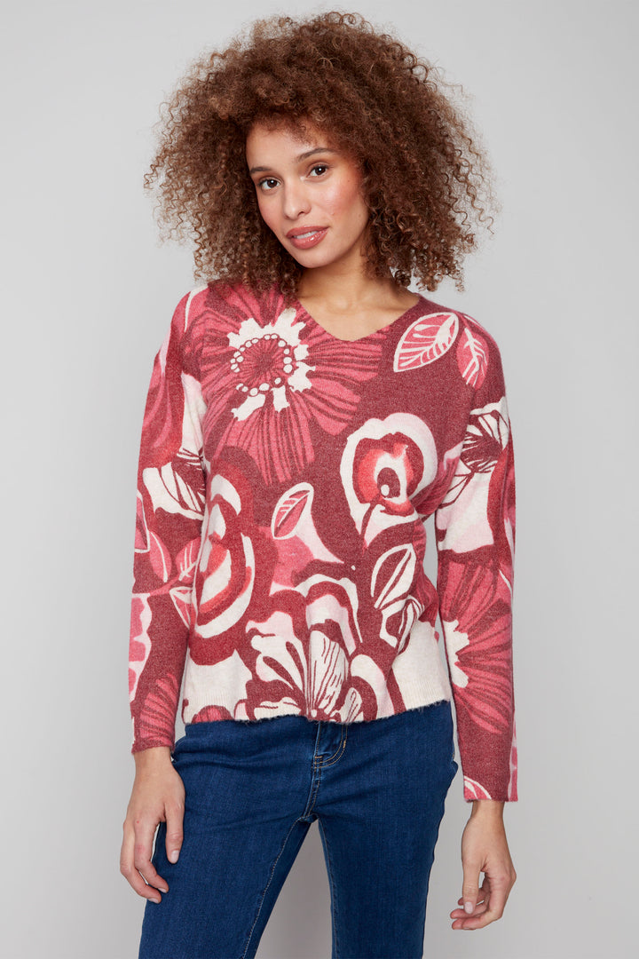 Charlie B Fall 2025 
This lively sweater top is made from plush knit fabric, giving you a comfortable and stylish look. With a v-neck and full length sleeves with drop shoulders, it's perfect for any casual occasion. 