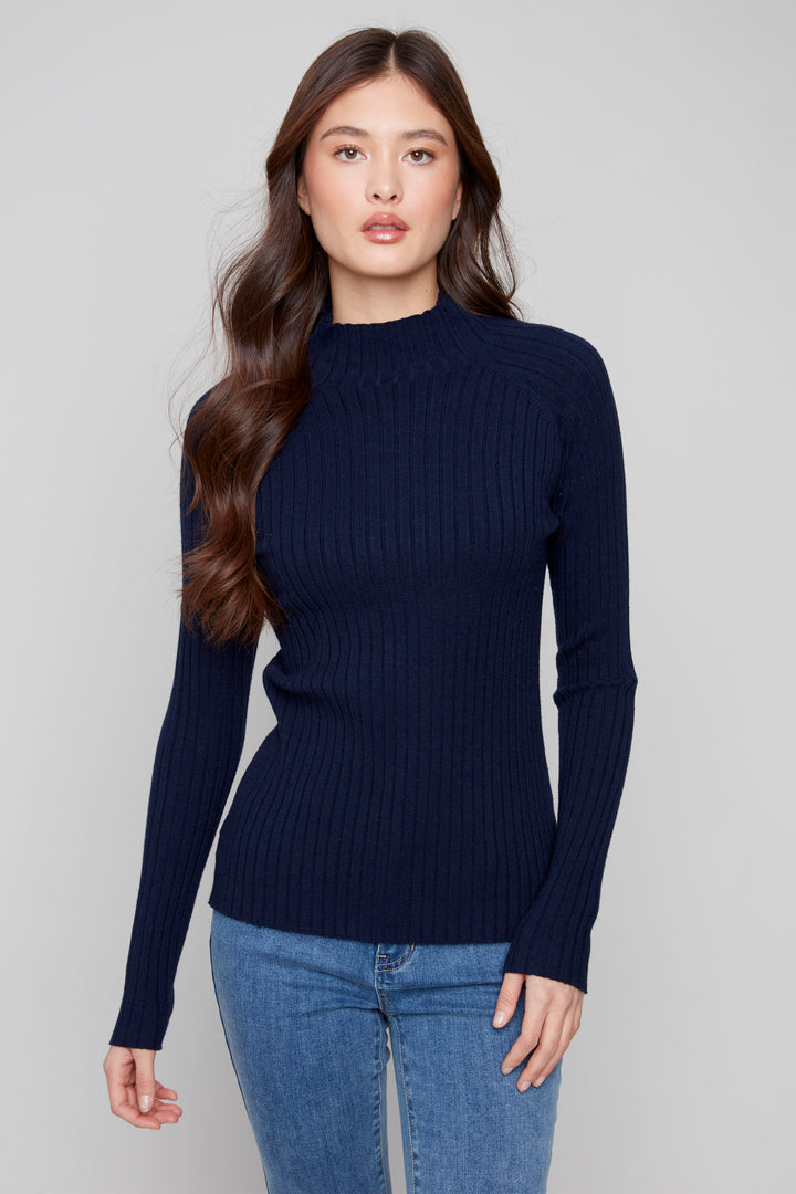 Charlie B Fall 2025 
Premium and lightweight, this sweater top features an elegant ribbed pattern with a classic mock neck to keep you warm and stylish through all seasons.