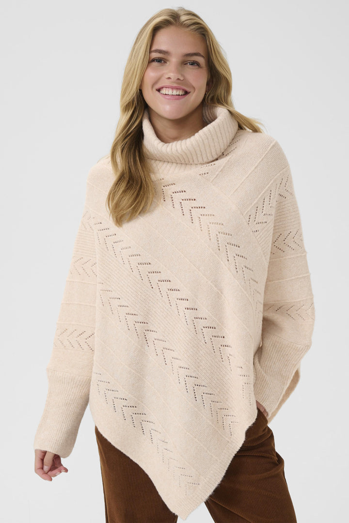 CREAM Fall 2025 
Crafted from light, flowy fabric, it drapes gracefully, enhancing any outfit with warm, cozy tones. Its luxurious turtleneck and poncho style combine timeless design with modern comfort, making it perfect for layering in cooler weather.