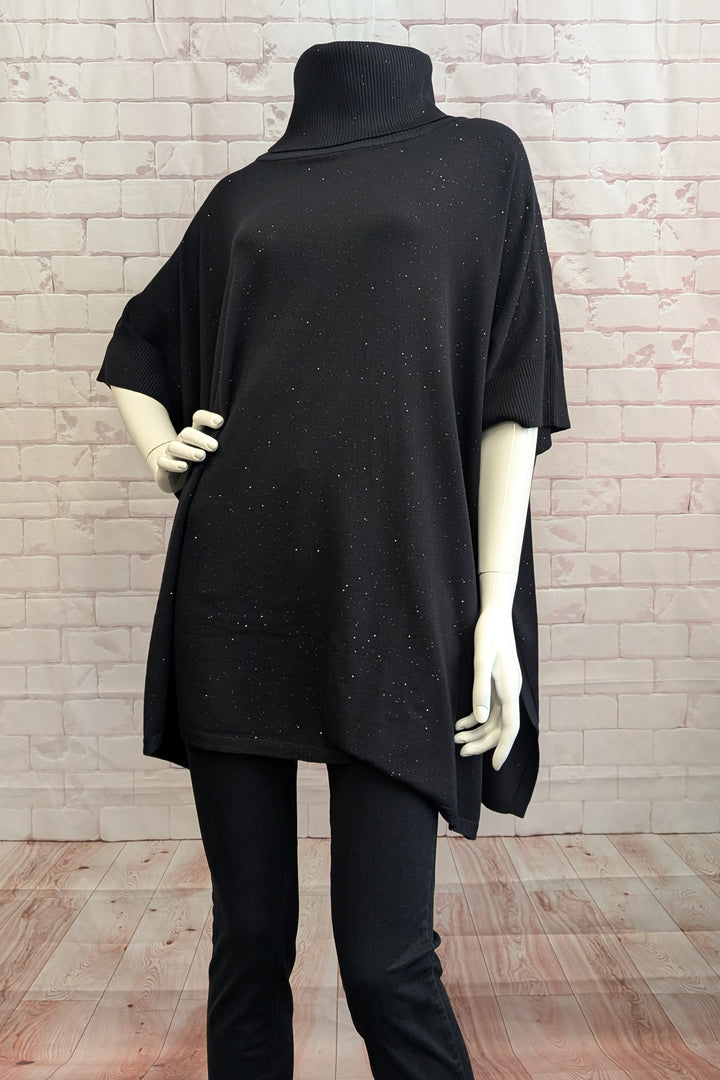 CASA DONNA Fall 2025 
Elevate your wardrobe with this Cowl Neck Glitter Poncho, designed for effortless style and comfort. Featuring side slits for easy movement, a relaxed, loose fit and a softly draped cowl neck, it combines understated quality with subtle sparkle from delicate glitter accents.