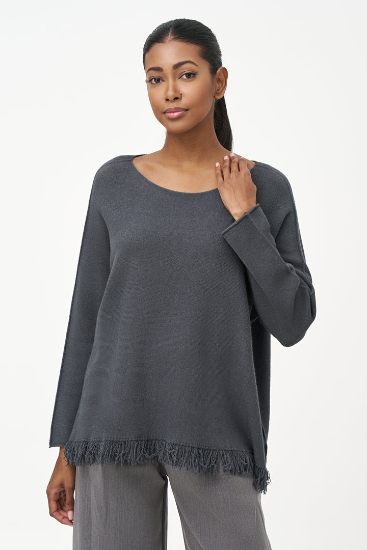 M Italy Fall 2025 
This LS sweater top features a flattering boat neckline and delicate pleated sleeves, adding subtle elegance to your look. The soft knit fabric drapes lightly and loosely for all-day comfort, while fringe hems introduce a playful, stylish edge.