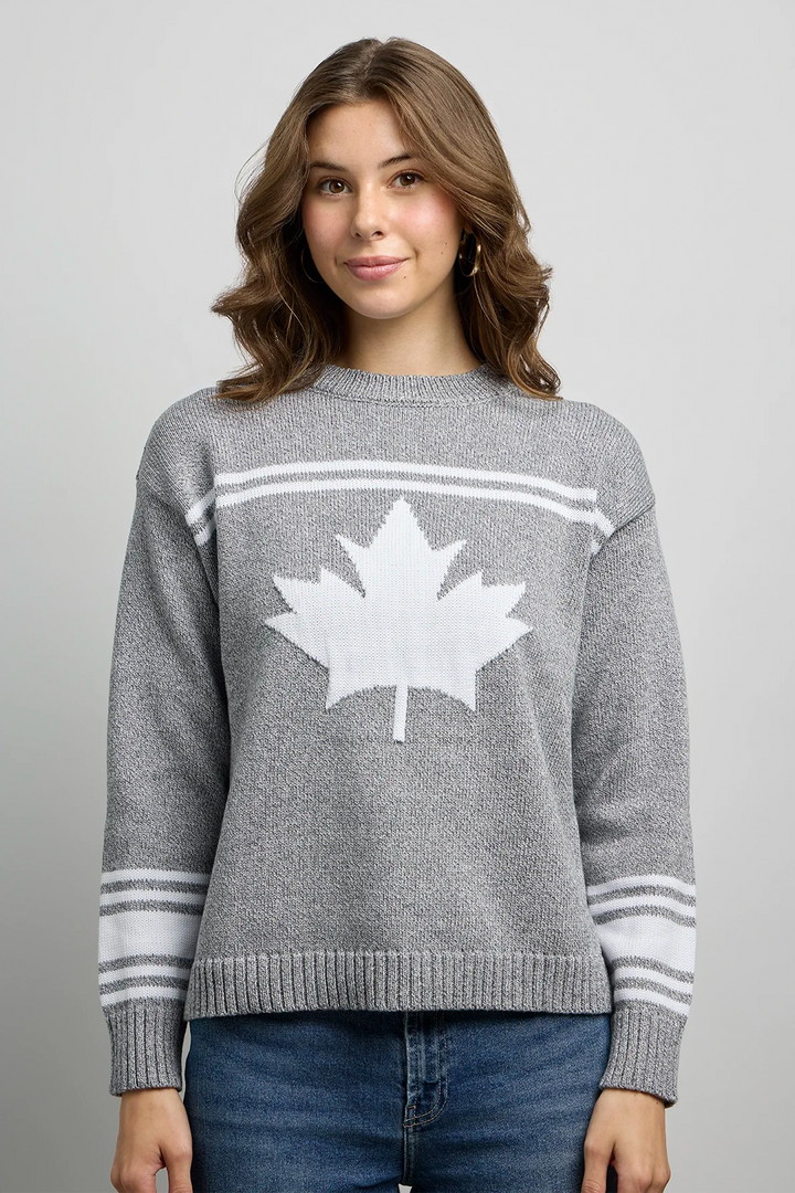 CANADA KNITWEAR Fall 2025 
Featuring all classic elements of a winter sweater, it showcases a striking white maple graphic on the front, complemented by subtle contrast stripe detailing.