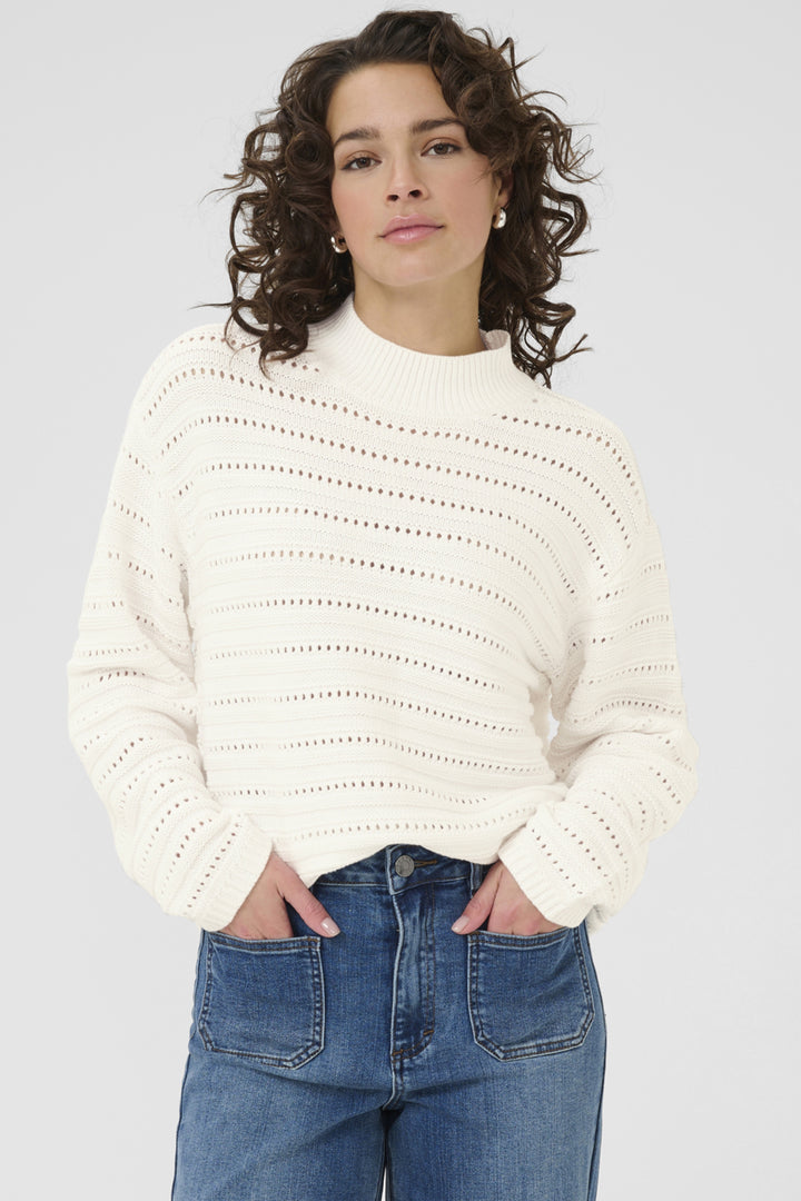 KAFFE Fall 2025 
This mock neck sweater top combines a trendy boxy cut with long, loose sleeves for a comfortable yet polished look. 