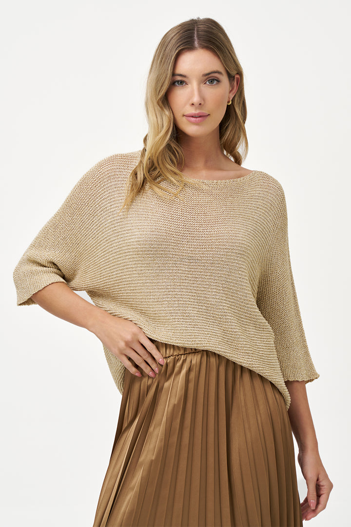 M ITALY Fall 2025 This light sweater top features a delicate crochet fishnet knit in solid colours, offering a lightweight and breathable layer.