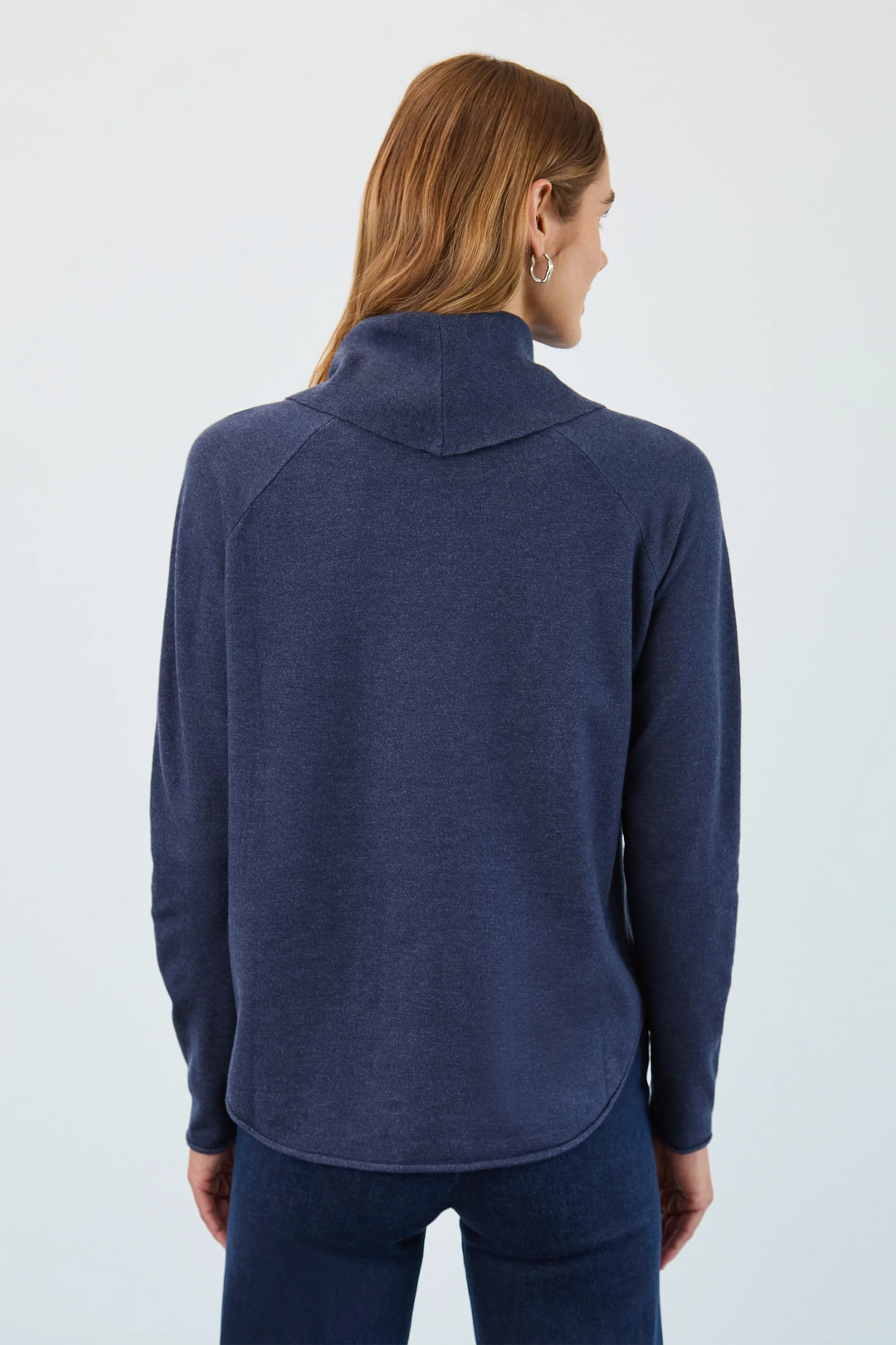 Person wearing a blue fleece jacket on a white background