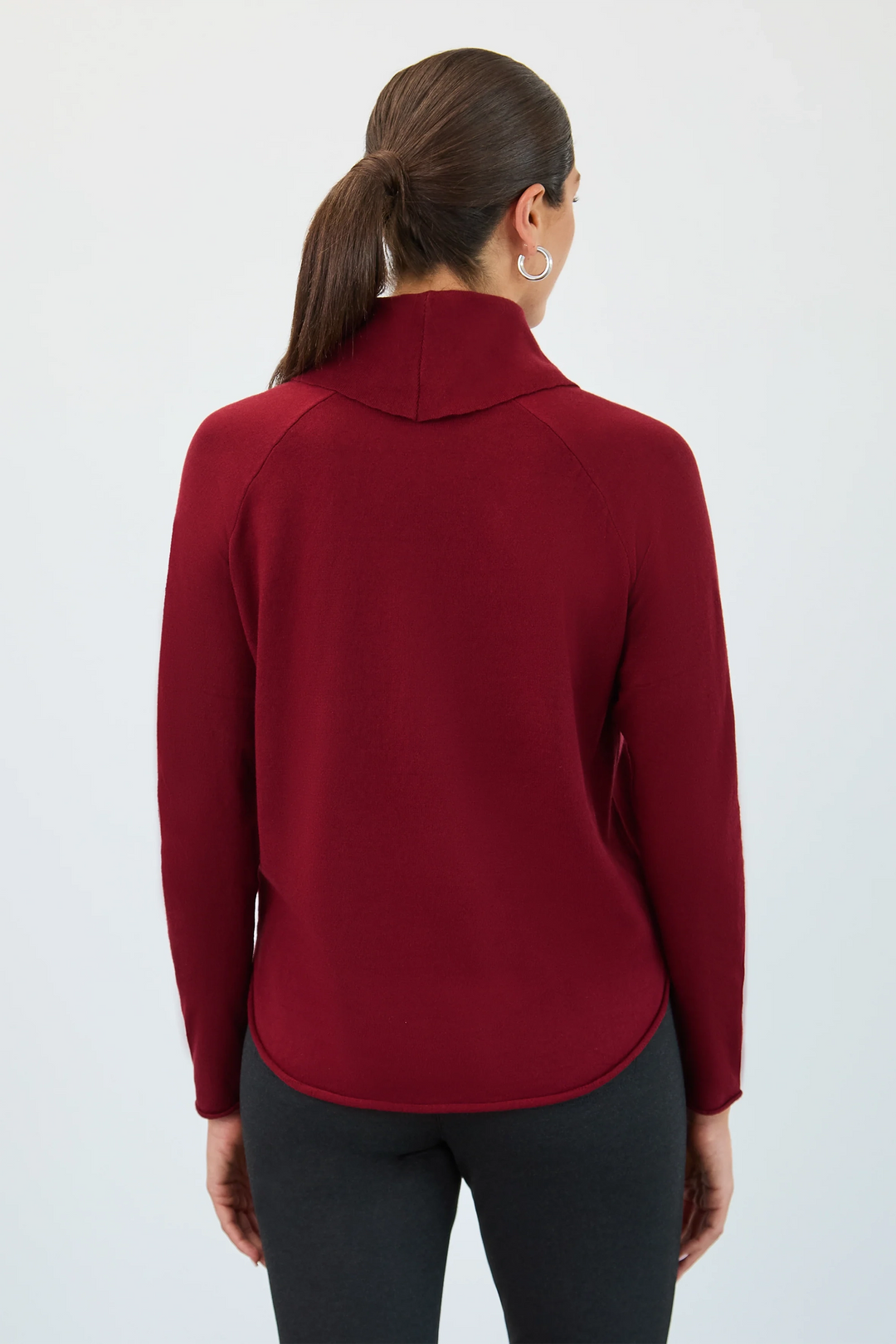 Person wearing a red jacket on a white background