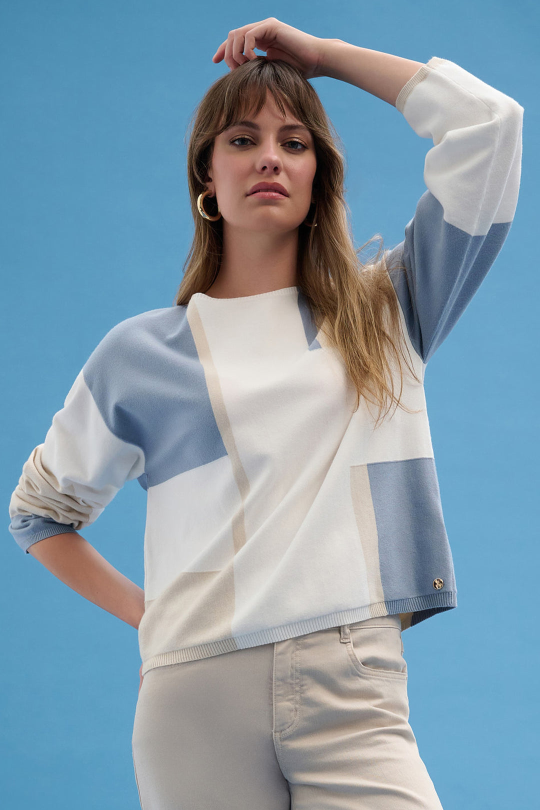 Joseph Ribkoff Spring 2026 
This Colour Block Knit Sweater Top features a cool geometric design that makes a bold style statement.