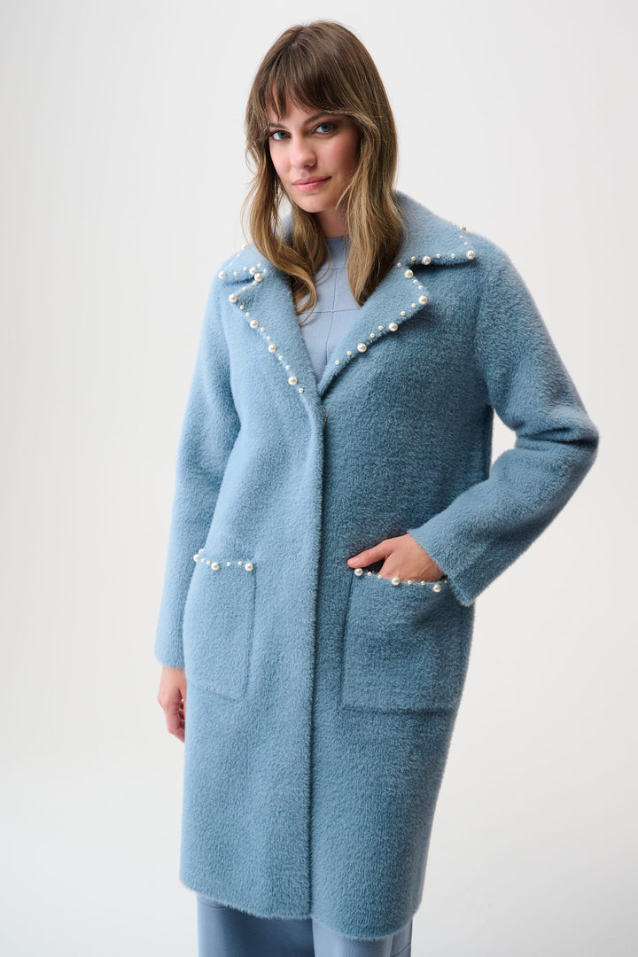 JOSEPH RIBKOFF Spring 2026 
Crafted from soft feather yarn, this sweater knit coat features a refined notched collar adorned with elegant pearl trim. Designed with a single snap button closure, it falls gracefully to the mid-thigh, offering a sleek silhouette. 