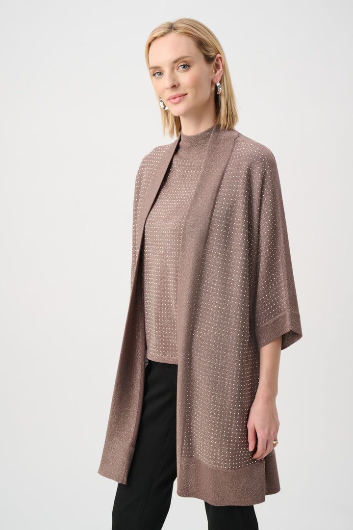 Woman wearing a brown textured cardigan on a white background