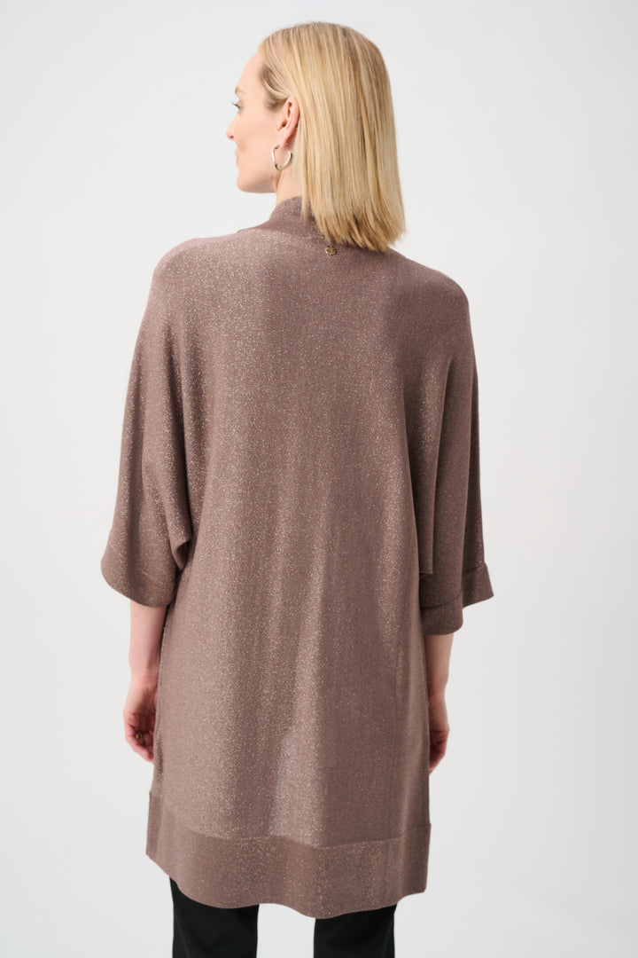 Woman wearing a brown cardigan on a white background