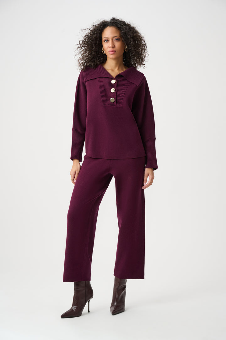 Woman wearing a purple outfit with a white background