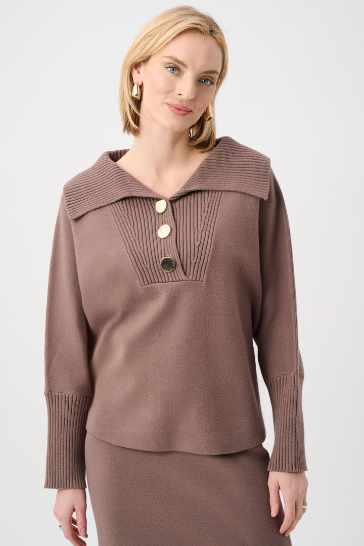 Woman wearing a brown knit sweater with a collar on a white background