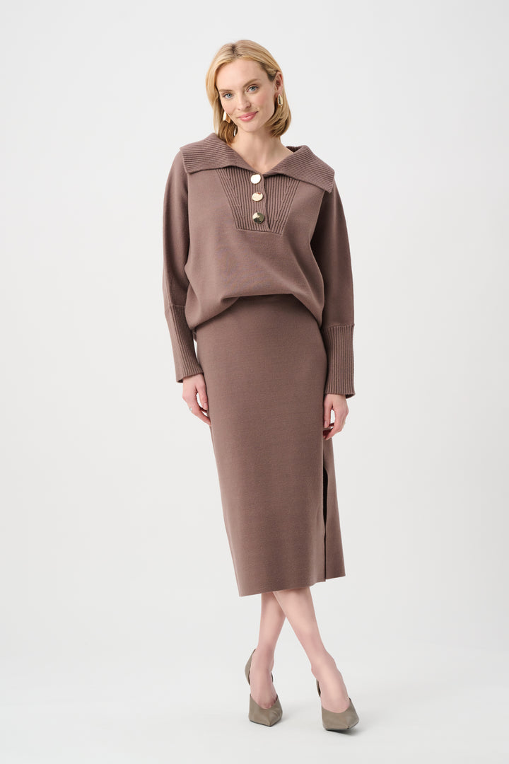Woman wearing a brown sweater and skirt set on a white background