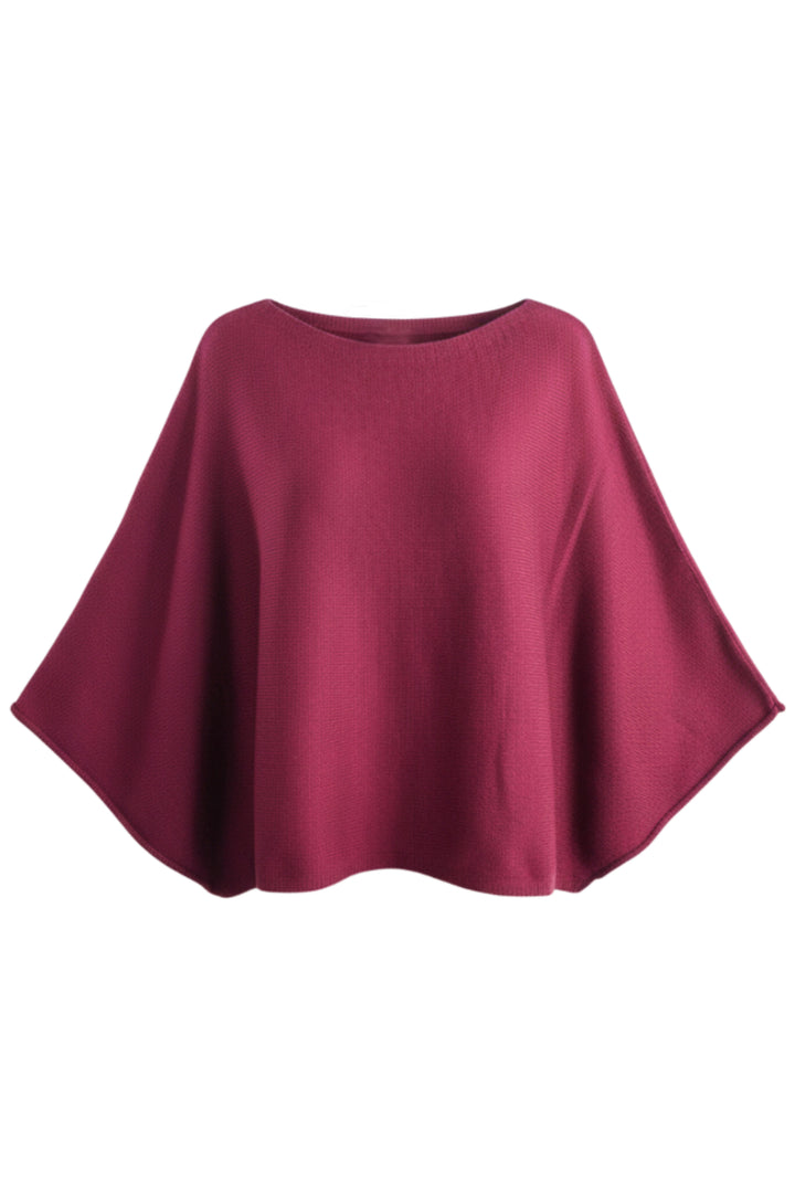 A solid burgundy knit poncho top with a wide, draped silhouette, shown against a plain white background.