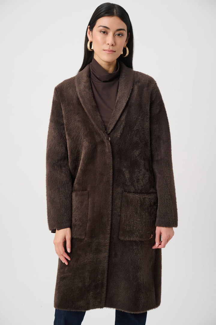 Woman wearing a brown coat on a white background