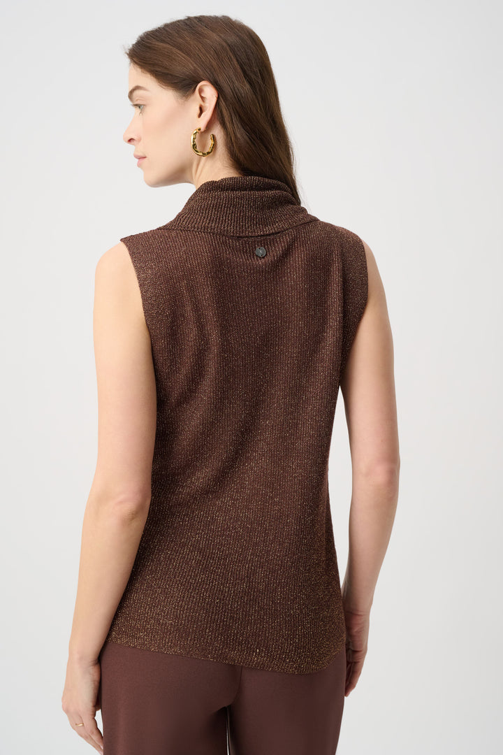 A woman shown from the back wearing a sleeveless brown ribbed knit mock neck vest against a light gray studio background.