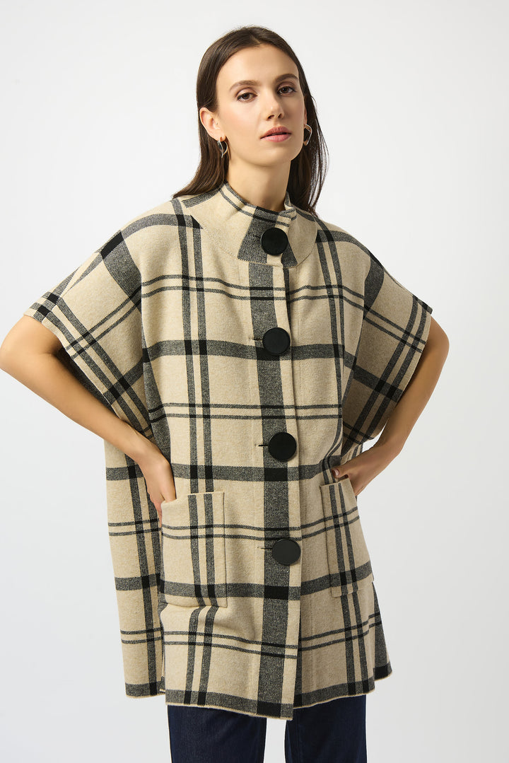 Joseph Ribkoff Fall 2025 
Featuring a bold plaid pattern and big solid front buttons, it offers a refined yet relaxed look. The mock neck and oversized fit create an effortlessly sophisticated silhouette, complemented by half-length loose dolman sleeves and large front pockets for added comfort and practicality.