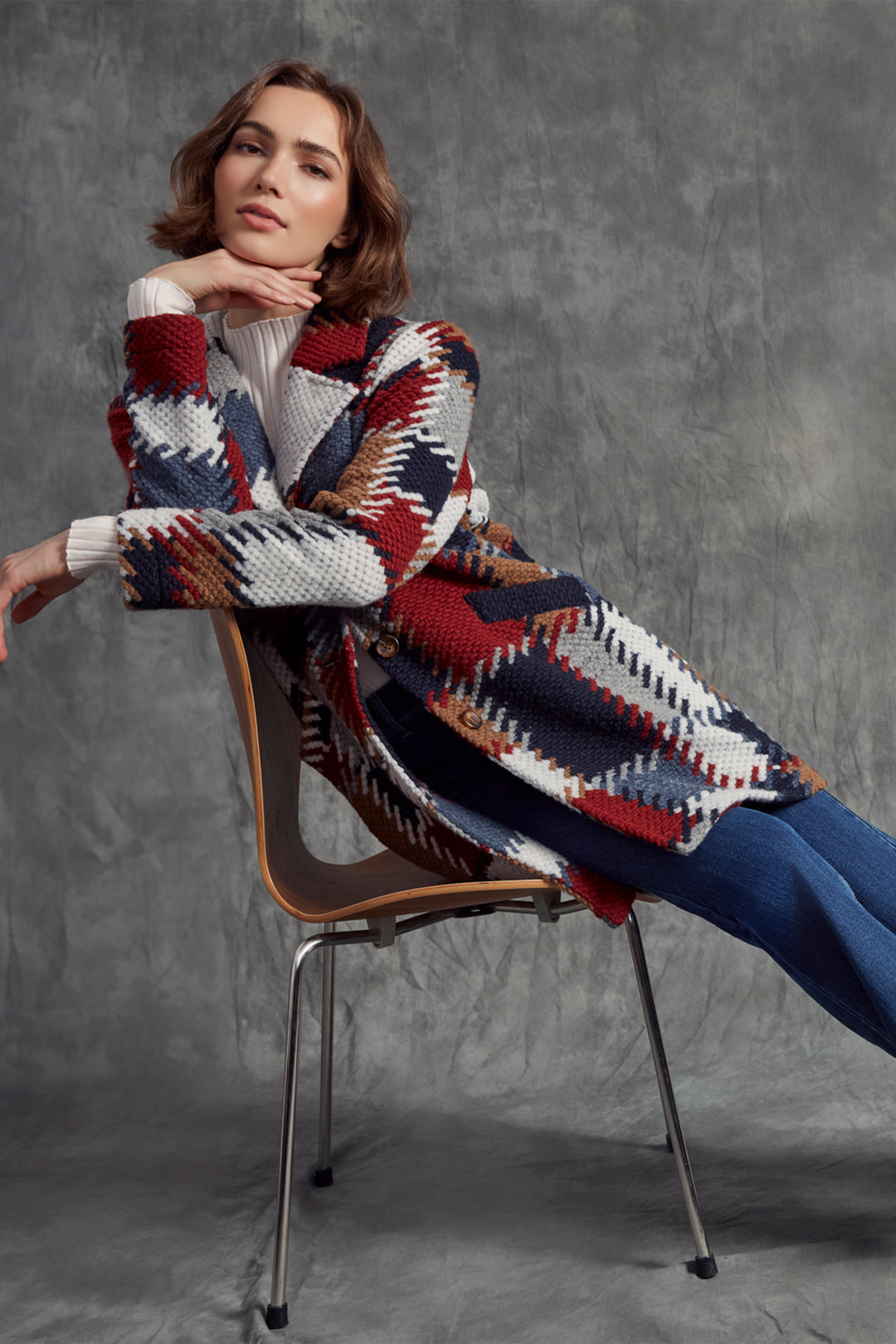 Charlie B Fall 2025 
 Featuring a playful unlined crochet knit in a stylish patch pattern, this long winter coat brings warmth with breathability. Front buttons add a charming touch while making it easy to layer over your favourite outfits. 