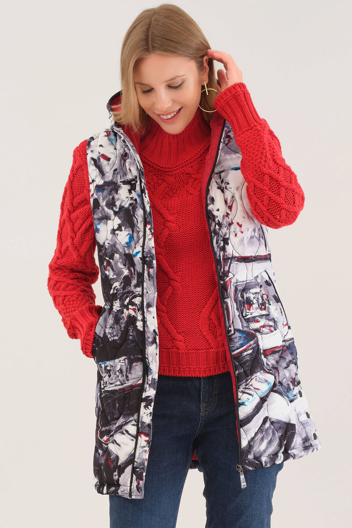 Dolcezza Fall 2025 
Stay stylish this Fall with our Piano Blues Long Hoodie Vest! It is a one of a kind! The light sheen and smooth, quilted material will keep you warm and comfortable. 