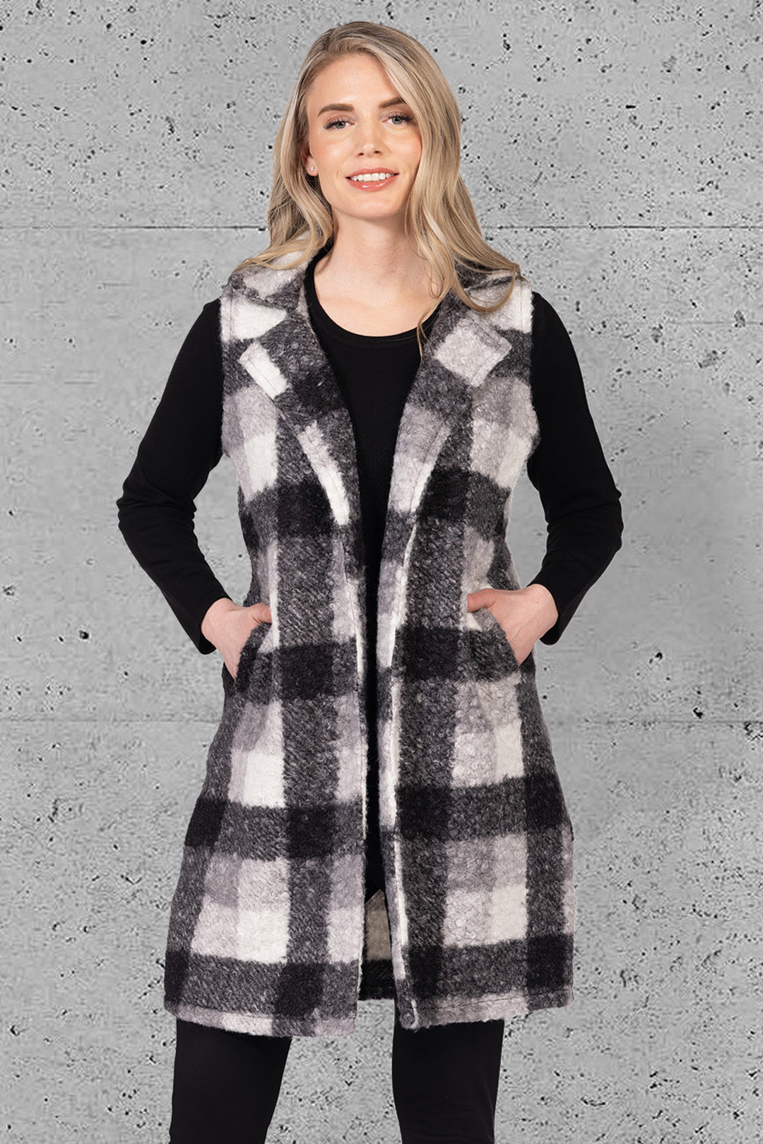 VARIATIONS Fall 2025 
 Designed with a classic notch lapel collar and practical front pockets, this long vest blends timeless tailoring with cozy comfort, making it an ideal layering piece for cooler seasons. 