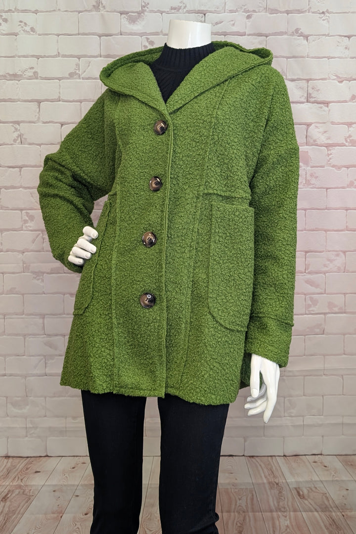 MARIE LA LUNE Fall 2025 
This boucle coat features a lightweight cotton and wool blend knit fabric providing comfort and texture. Designed with a more relaxed fit, it offers easy layering and freedom of movement. 