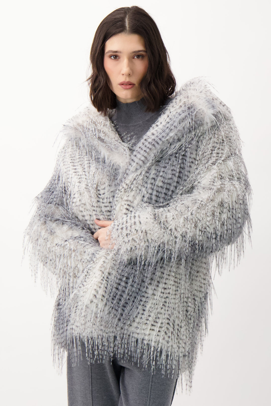 SPANNER Fall 2025  Featuring an easy throw-on, open-front design, this coat brings faux fur luxury with a twist. 