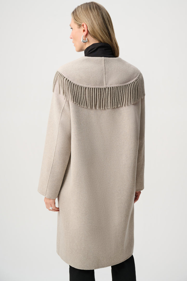 Beige coat with fringe details on a white background