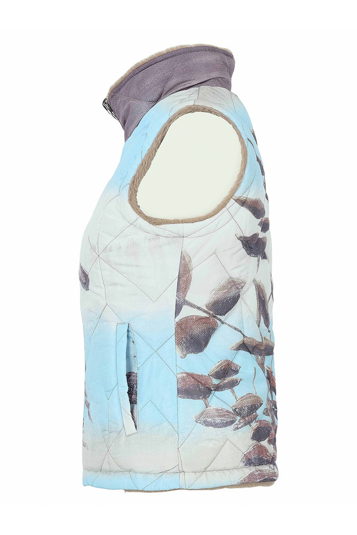 A sleeveless quilted vest with a light blue and white background featuring a brown leaf pattern, a gray collar, and a beige trim around the armholes.