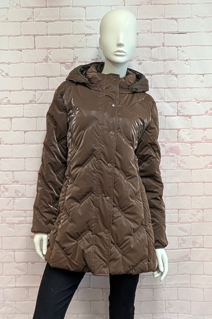 A mannequin wearing a An brown quilted hooded jacket with a snap-button front.