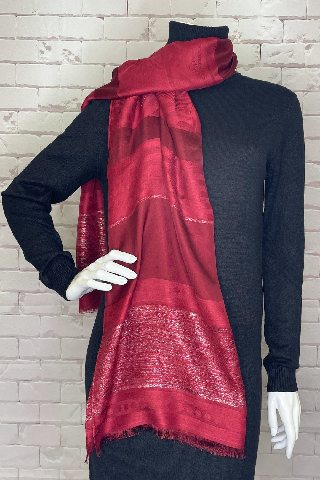 Boasting a stunning silver thread pattern design and light fringe detail, this ultra lightweight scarf will bring a touch of elegance and sophistication to any outfit.