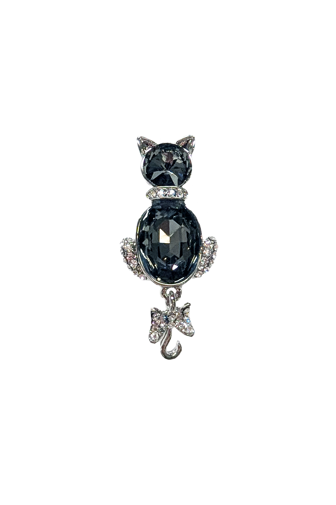 Cat-shaped brooch with a large black gemstone and a smaller clear gemstone on a white background