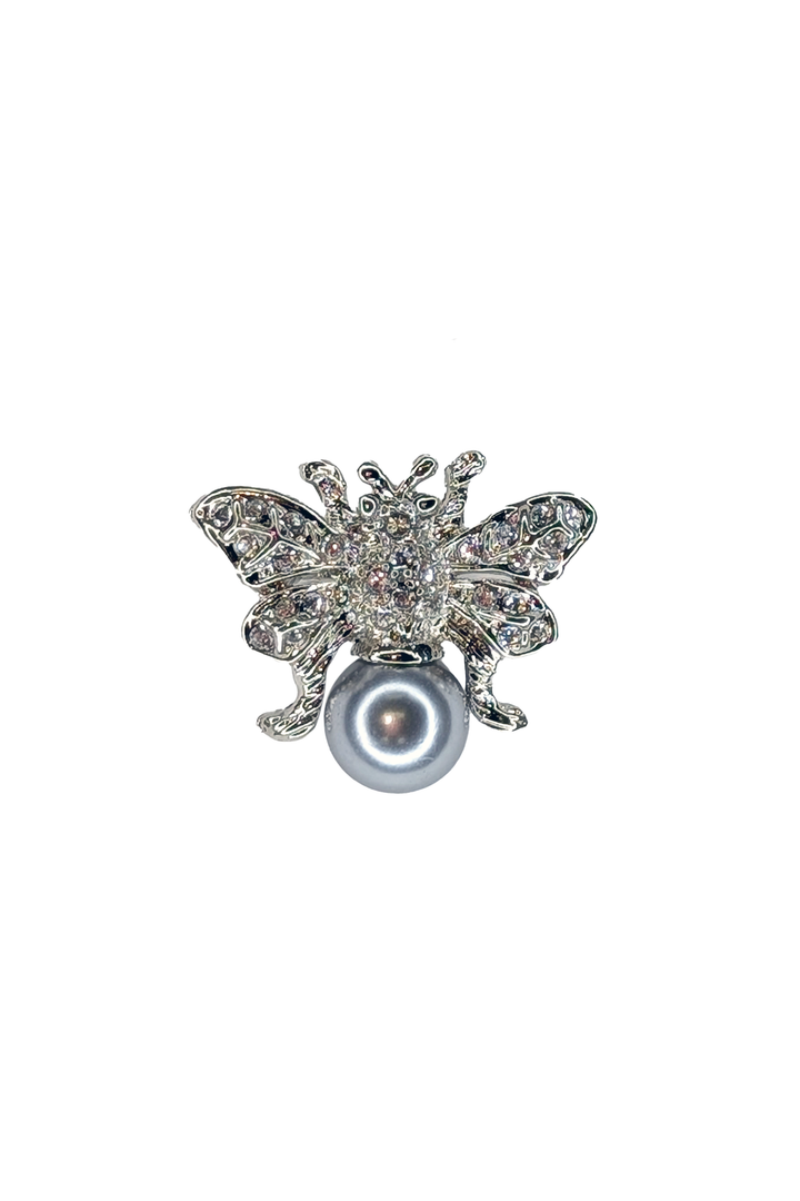 Silver Butterfly-shaped brooch with a pearl on a white background