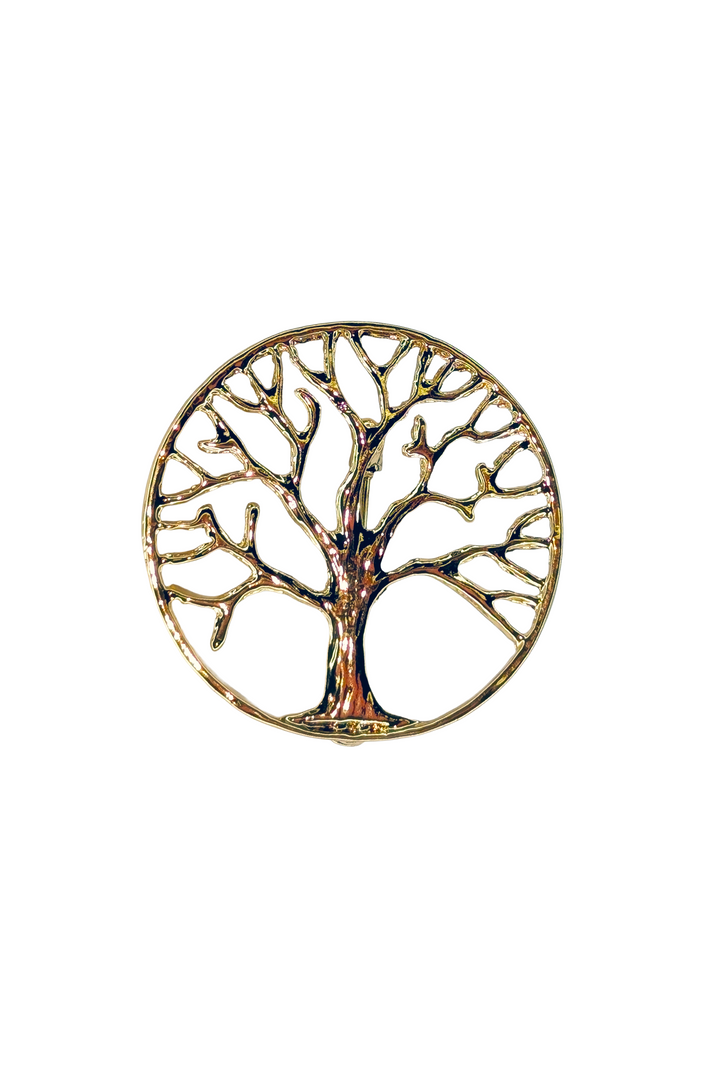 Decorative lapel pin with a tree design on a white background