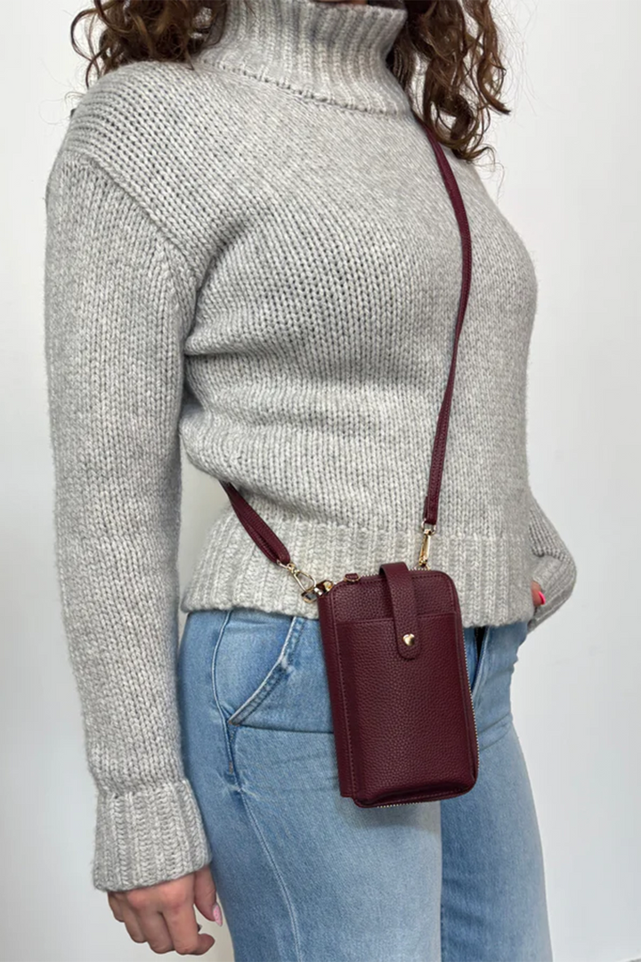 ESPE Fall 2025 
 The ever popular Smartphone Pouch!- the perfect accessory for any stylish individual! Made with slots for your cards, this classy cell phone bag is not only functional for you, but also makes a great gift idea! 