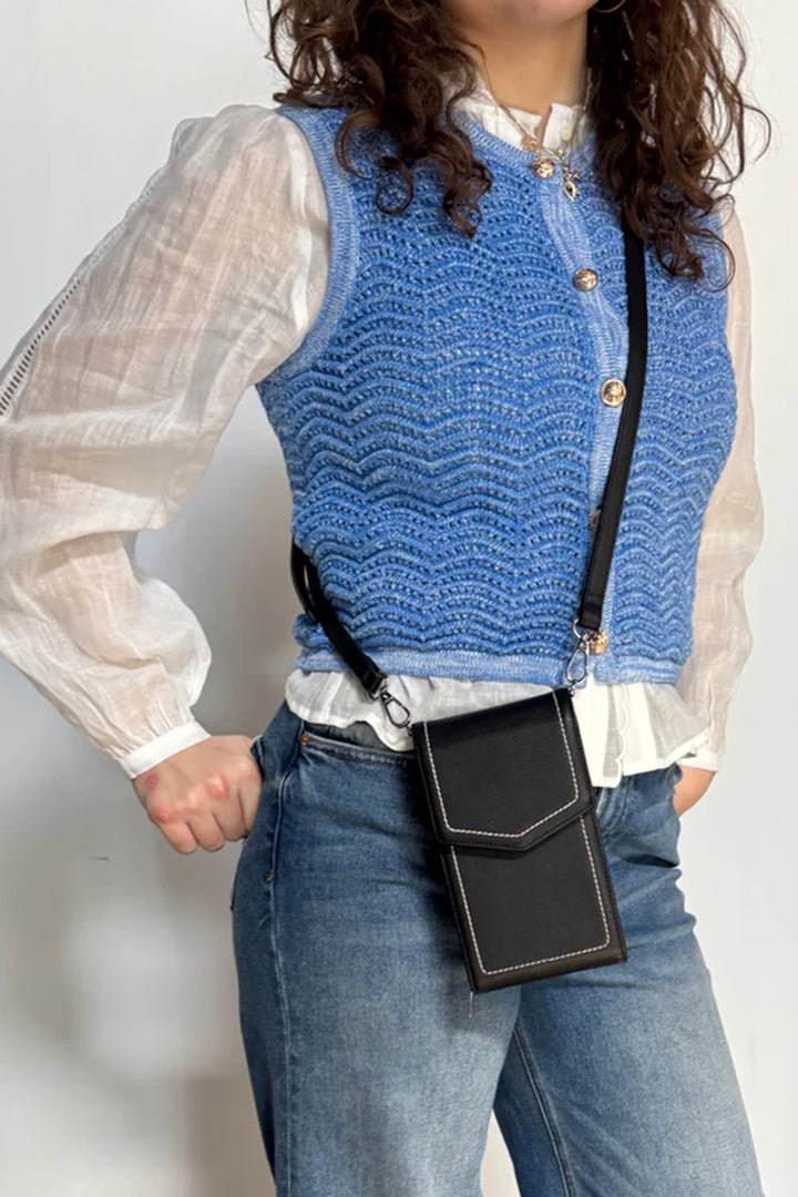 ESPE Fall 2025 
Featuring an adjustable, removable shoulder strap, it offers versatile crossbody wear for hands-free convenience. Thoughtfully designed with slots for your cards, glasses and small essentials, this compact bag keeps everything organized and within easy reach—perfect for those who value both fashion and function!