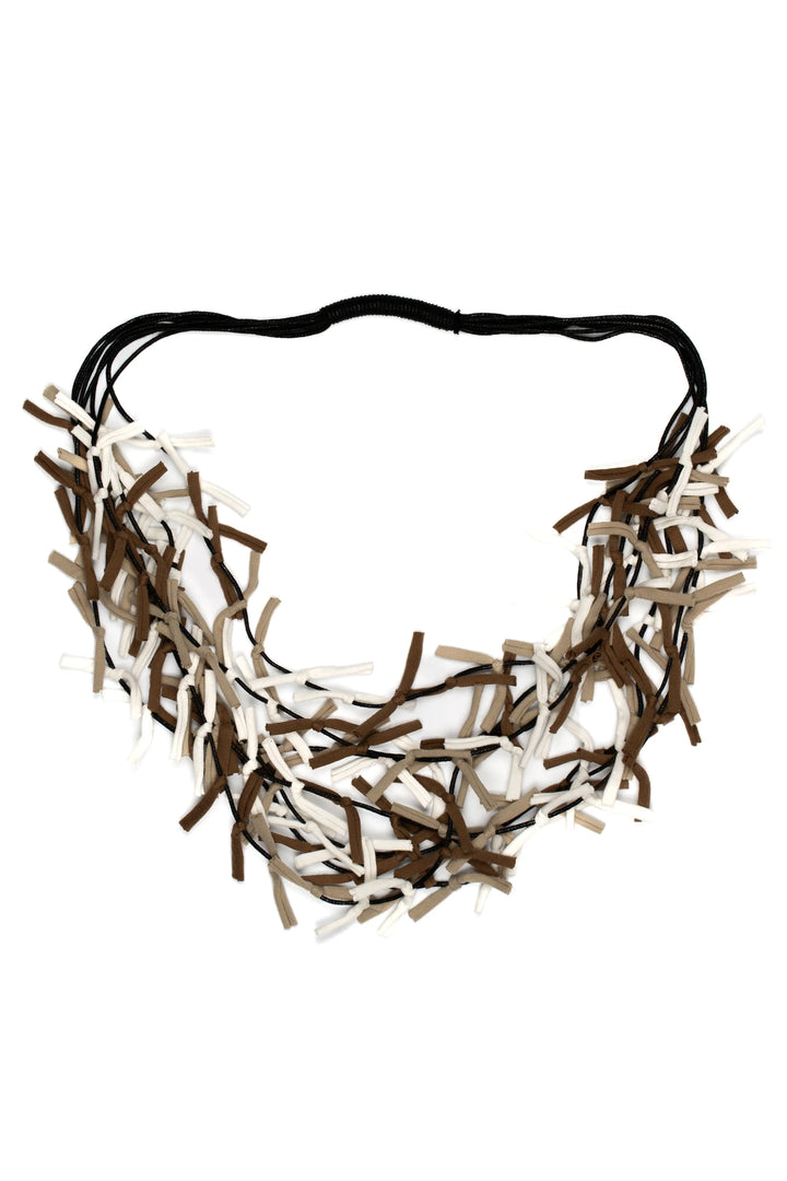 Necklace with brown and beige ribbons on a white background