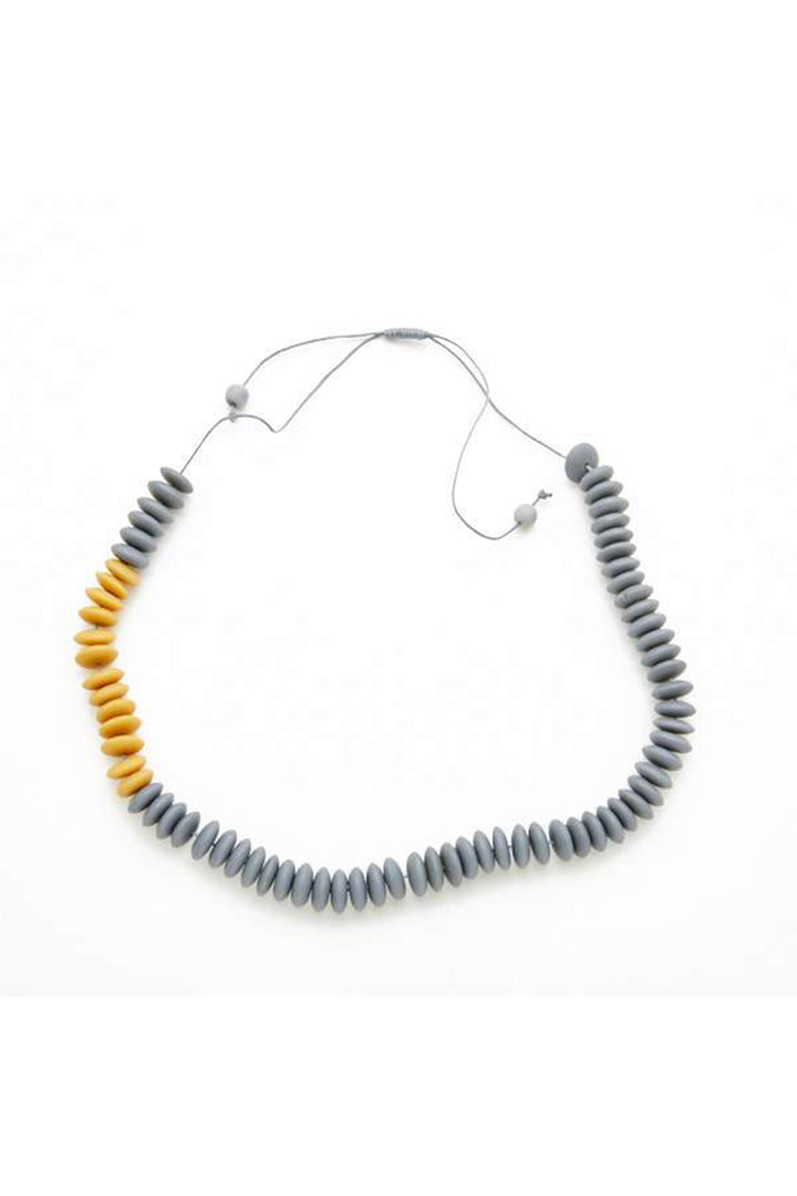 Necklace with gray and yellow beads on a white background