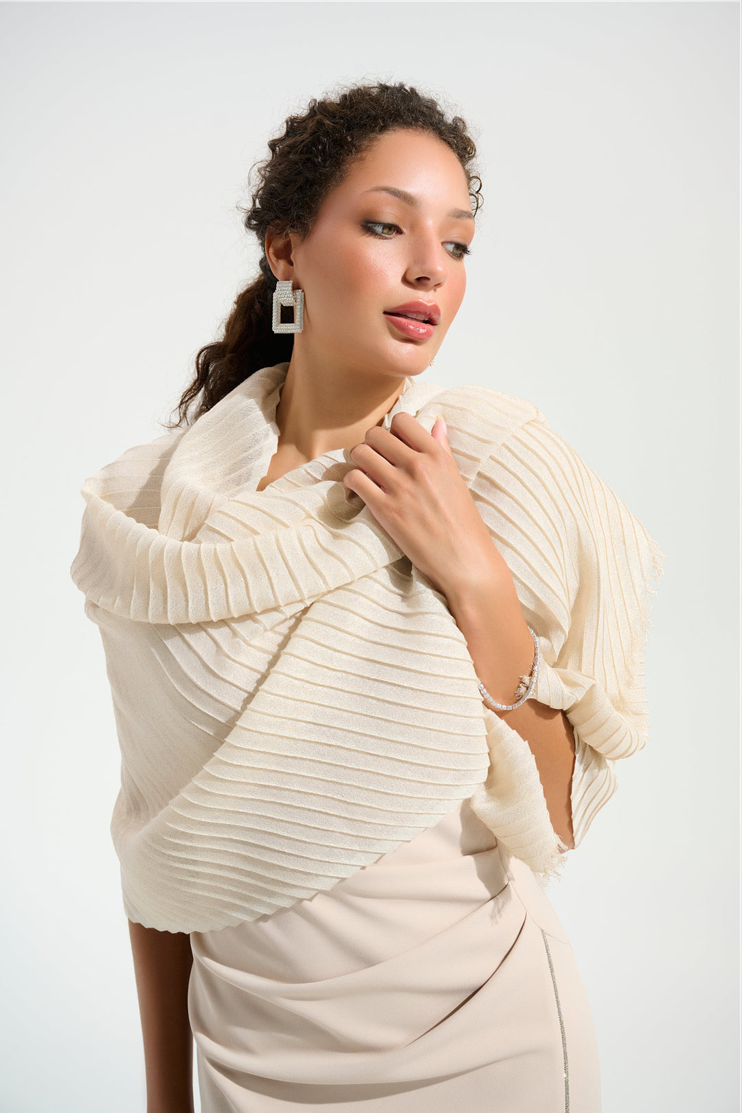 JOSEPH RIBKOFF Spring 2026 
Elevate your ensemble with this refined pleated scarf, where delicate craftsmanship meets effortless elegance. The distinctive pleated design adds textural interest and movement, while the silky fabric drapes beautifully against the skin.