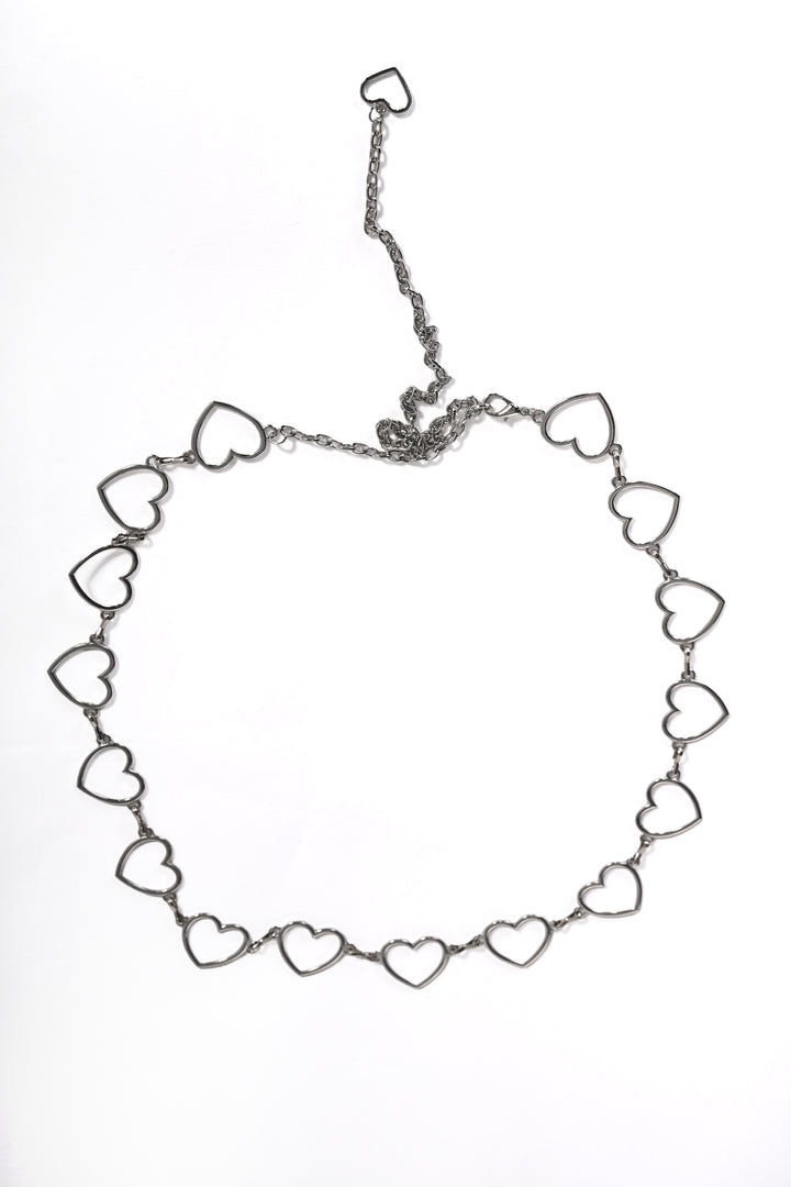 Silver heart-shaped belt on a white background