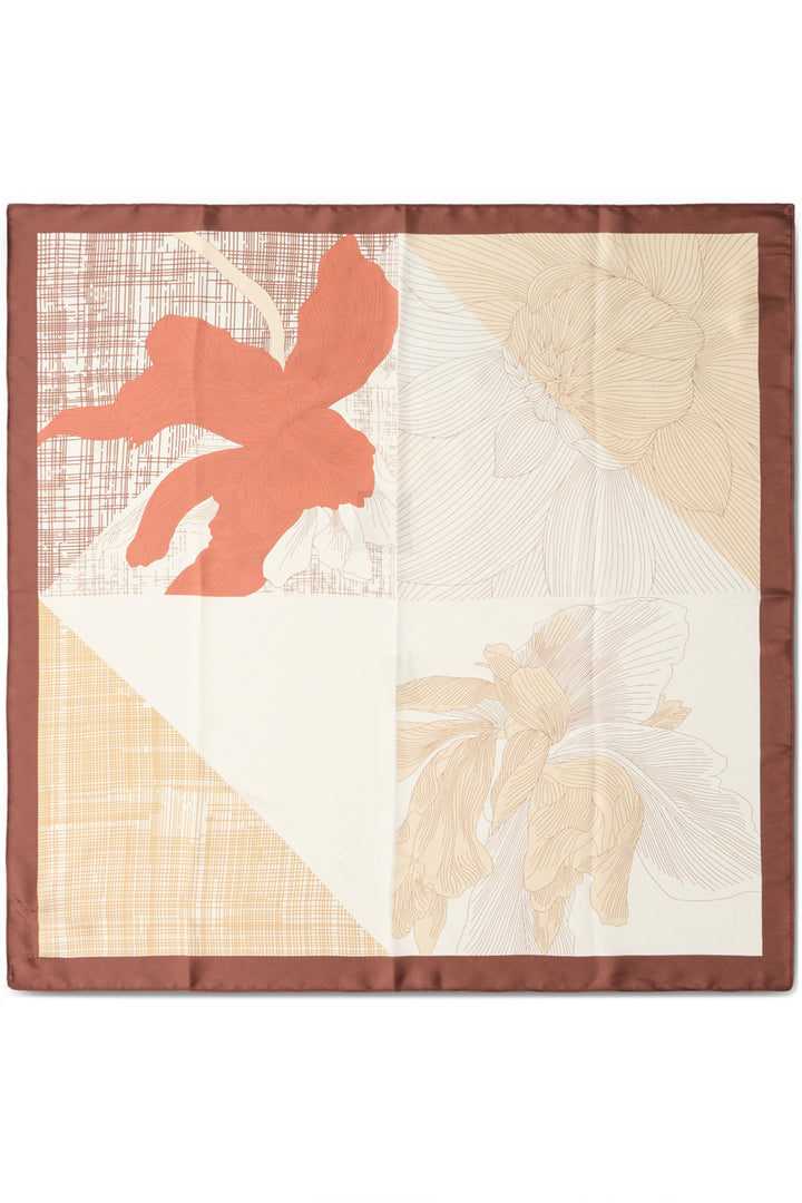 Decorative quilt with floral patterns on a white background