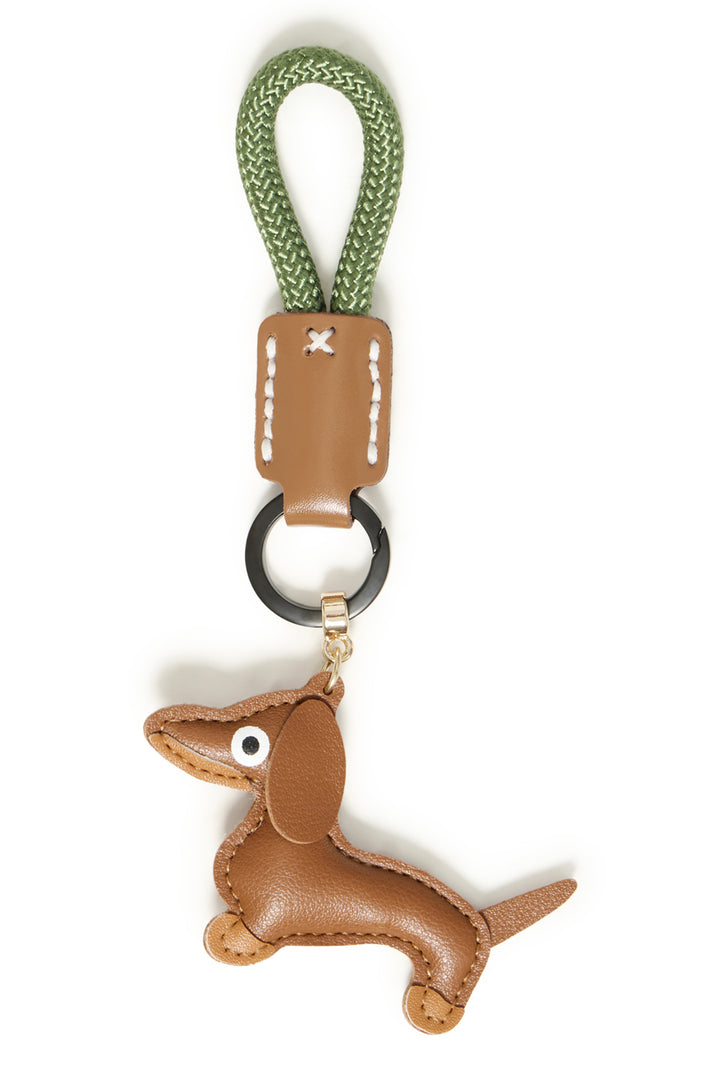 Leather dachshund keychain with green strap on a white background