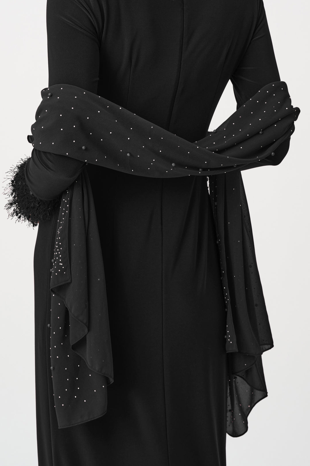 Matching scarf draped over the shoulders on a white background