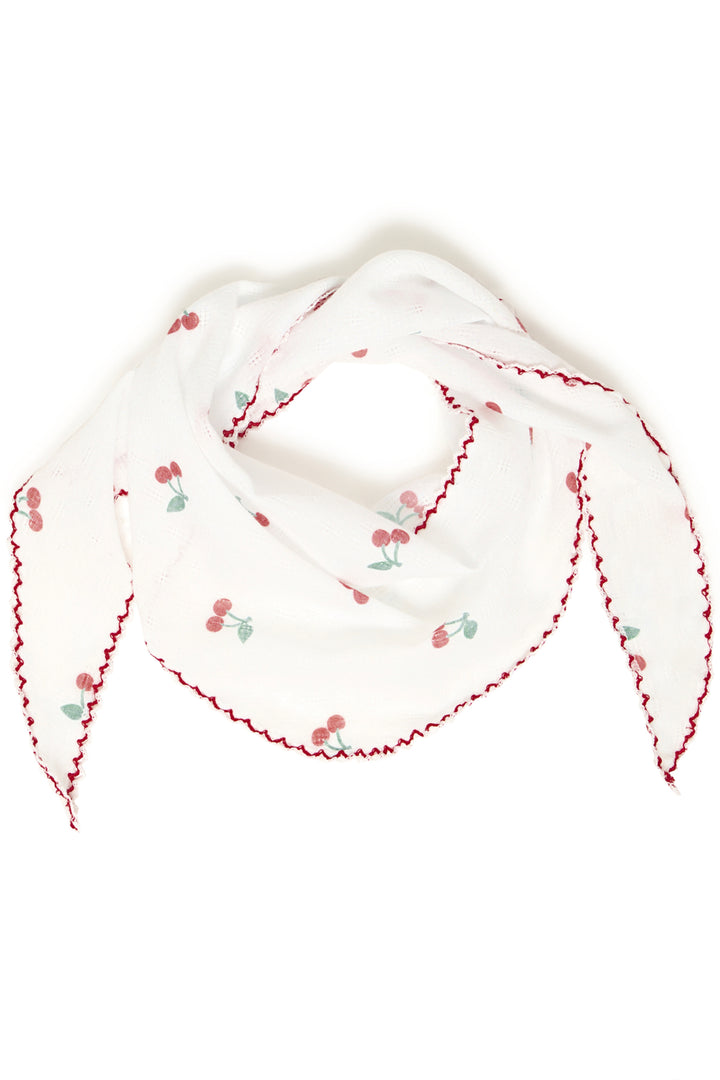 White headscarf with red floral embroidery on a white background