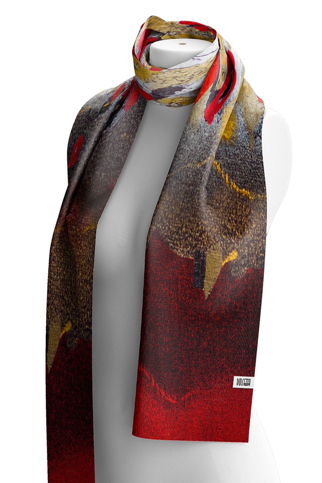 A long abstract-patterned scarf draped on a white mannequin torso against a white background. The scarf features a mix of red, gold, brown, black, and gray tones in a painterly, textured design.