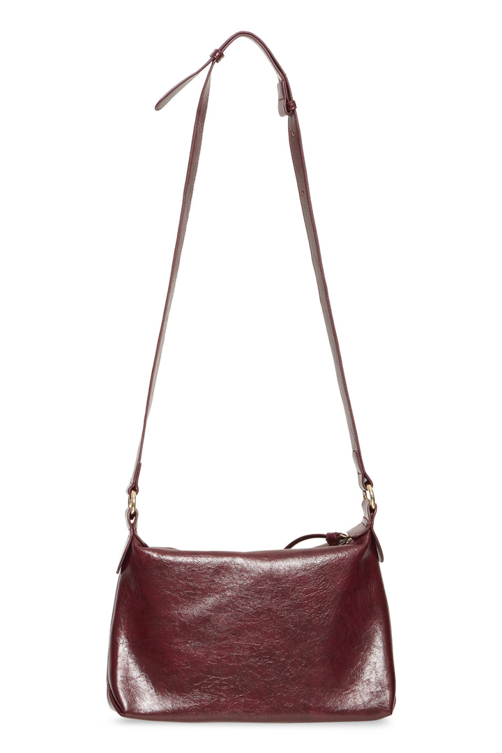 A dark burgundy leather shoulder bag with a long adjustable strap and gold-tone hardware, shown against a plain white background.