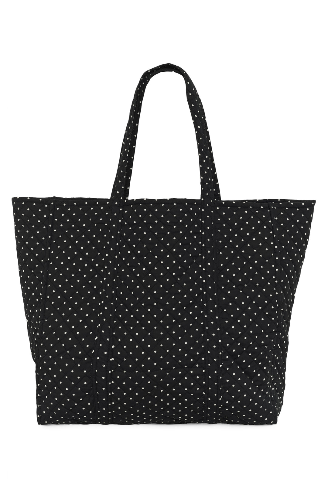 A women's black and white polka dot quilted tote bag. 