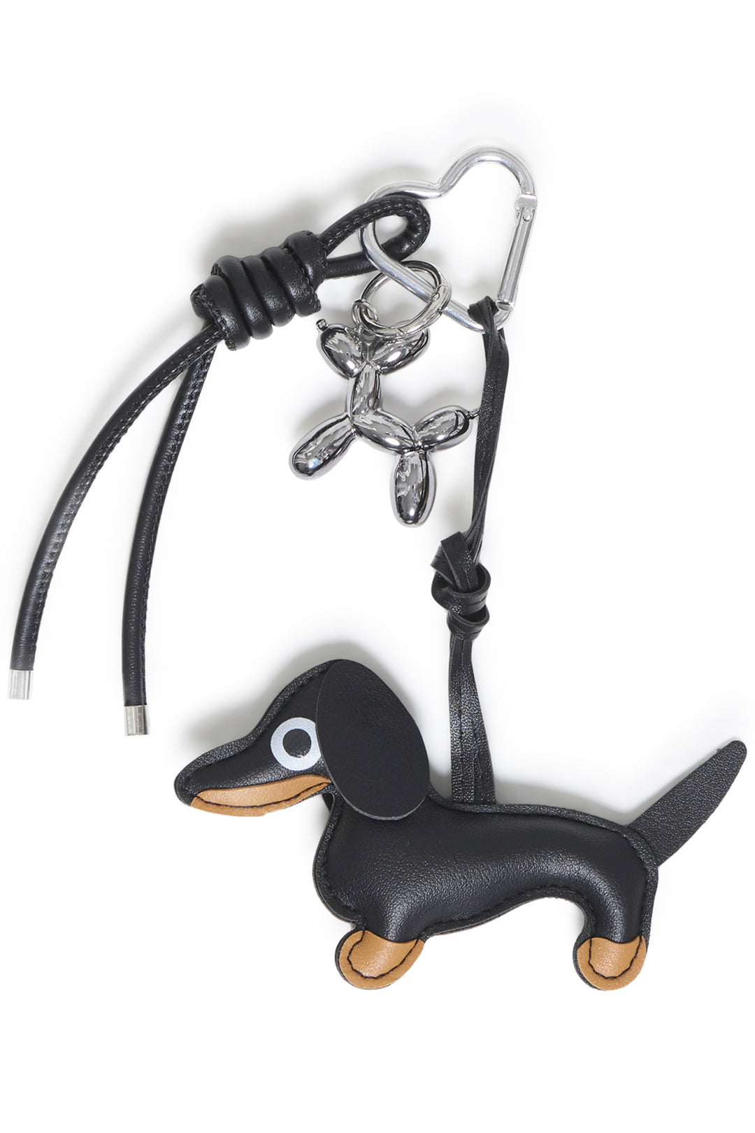 A black dog bag charm shown against a white background. 